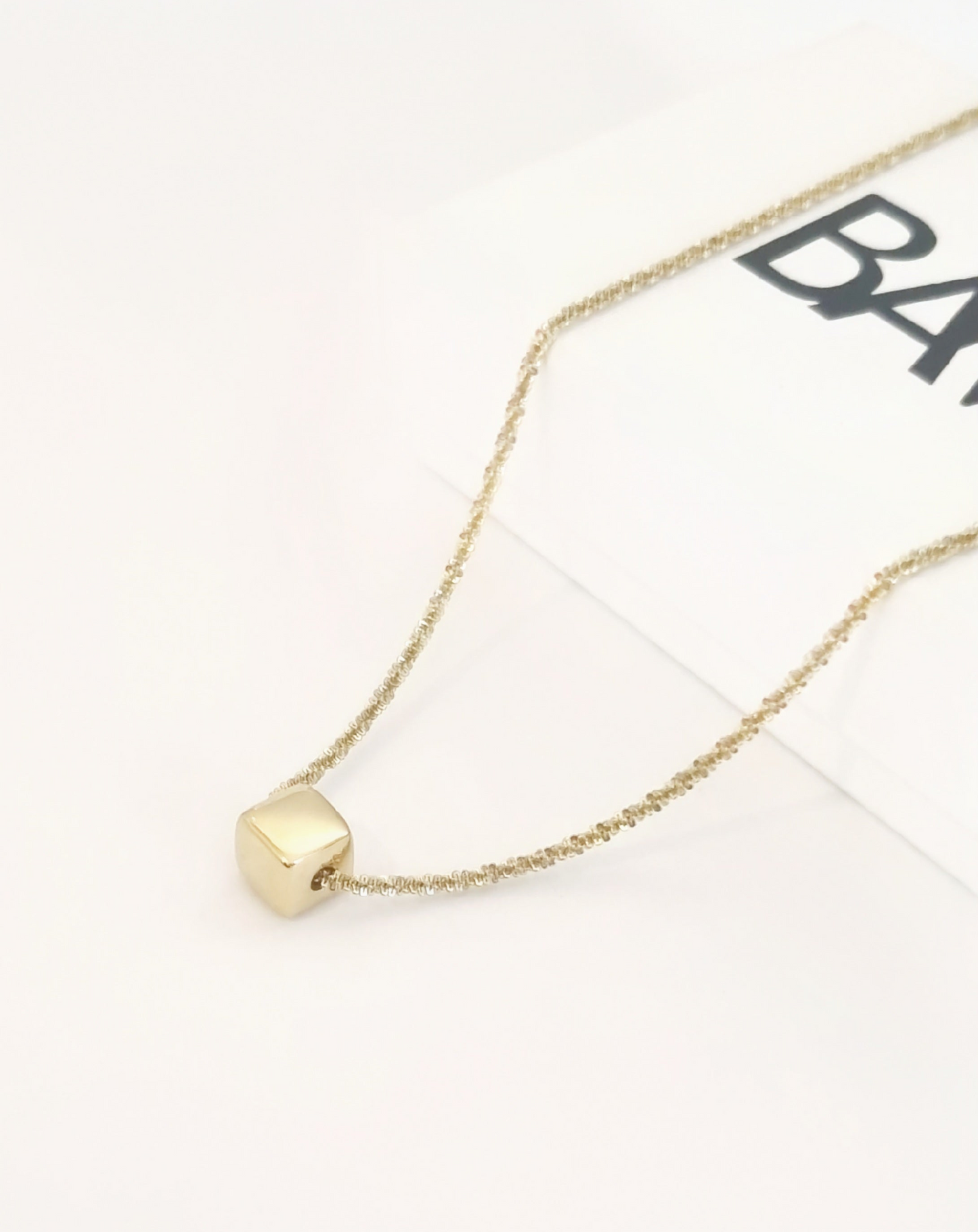Dé • Collier maille brillante pendentif cube