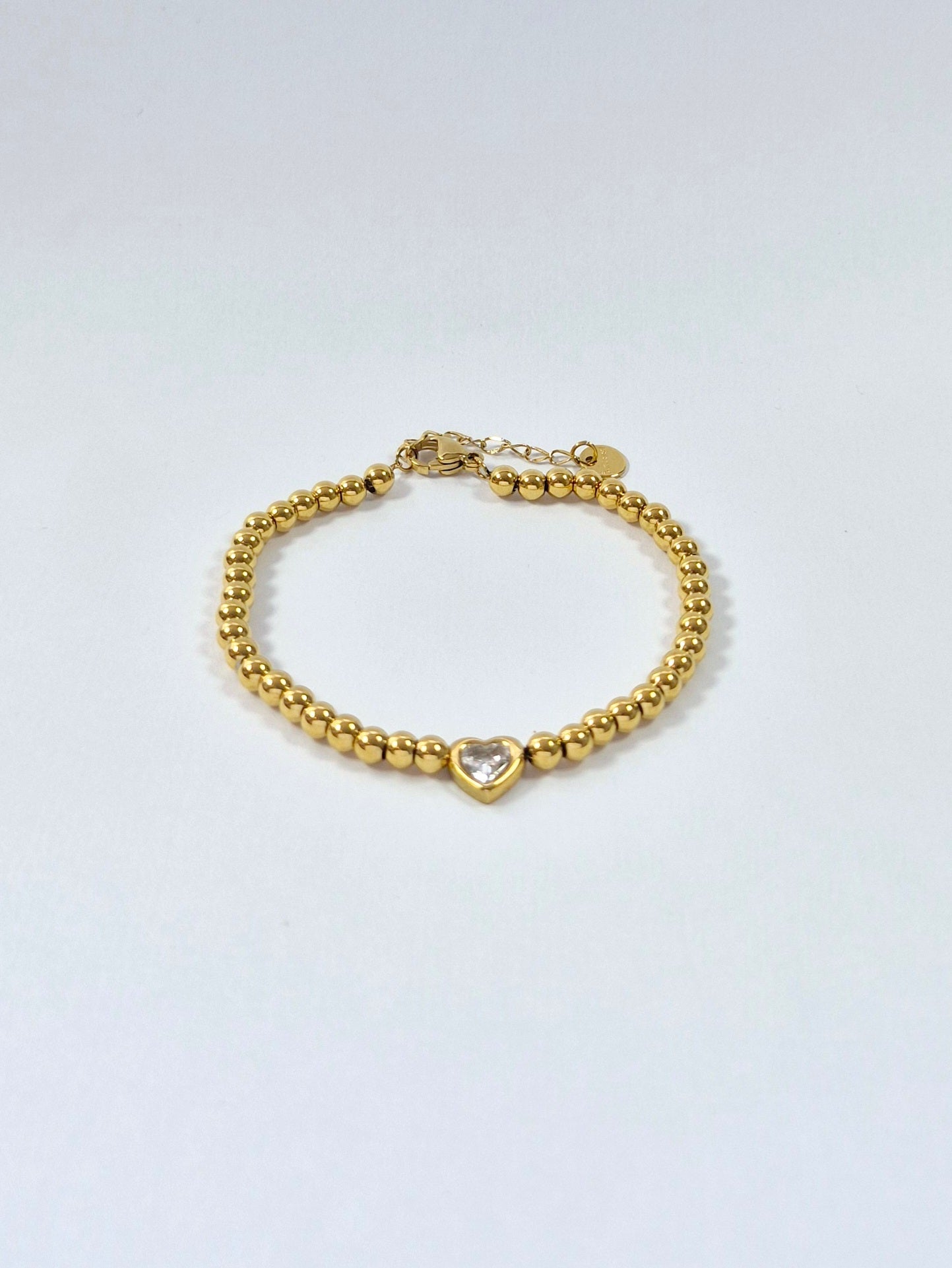 Bracelet perles dorées petit coeur