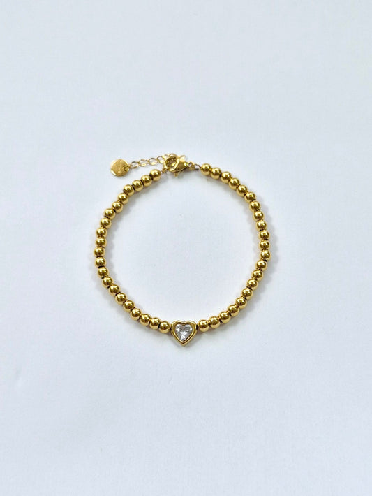 Bracelet perles dorées petit coeur